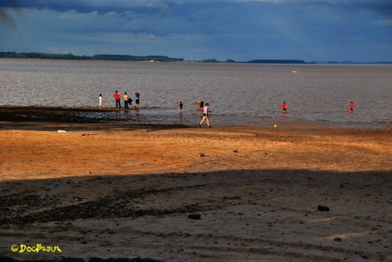 Foto 2/En la playa con sol y nubes